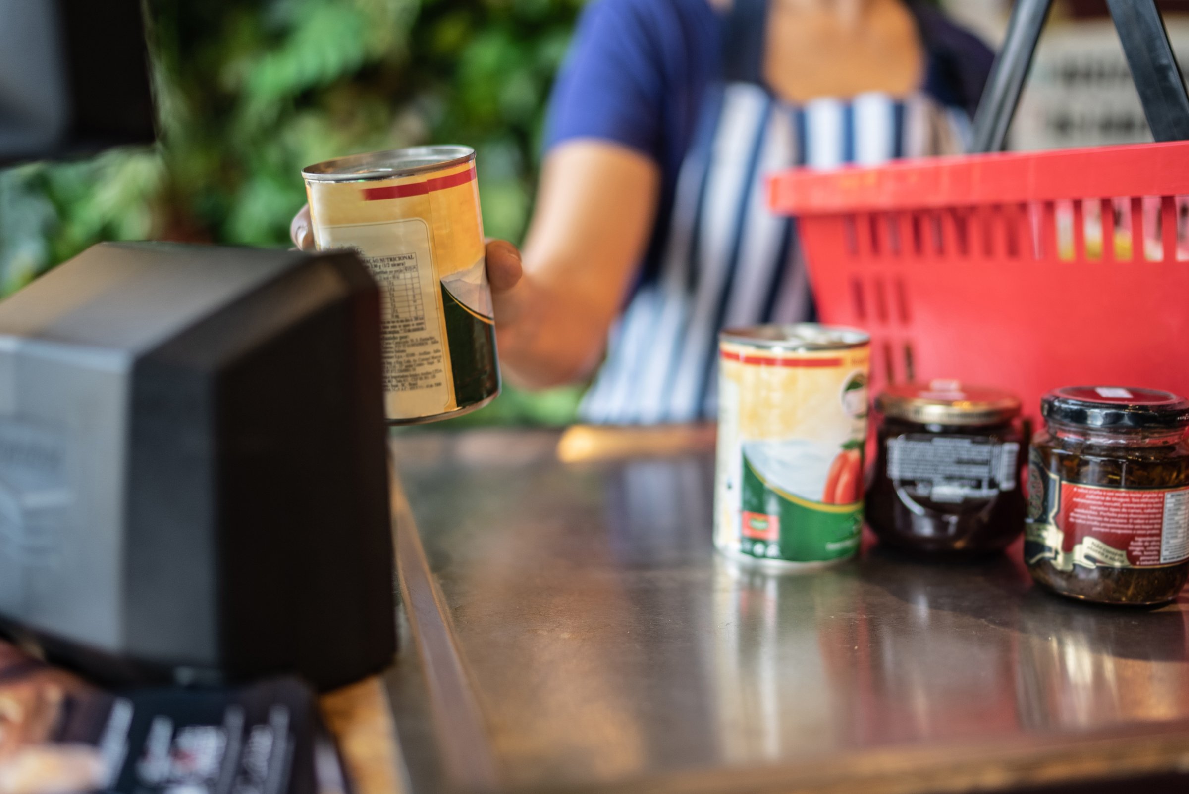 Cashier checking out groceries in a supermarket